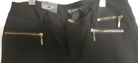 Black pants with gold zippers